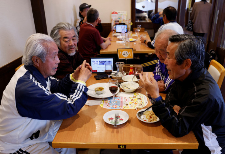The Wider Image: For Japan's ageing soccer players, 80 is the new 50