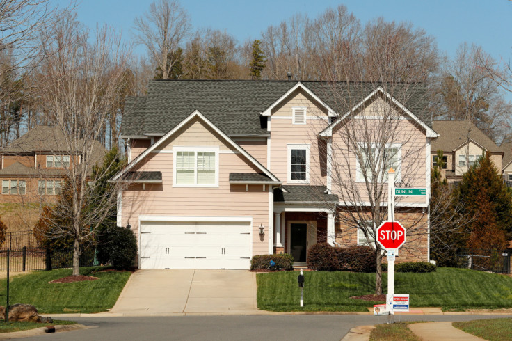 A home stands behind a real estate sign in a new development in York County, South Carolina