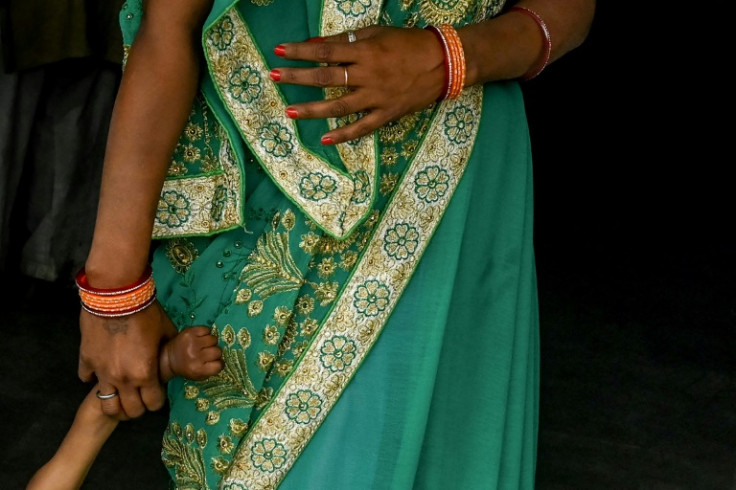 A woman arrives for sterilisation at a health centre in Bhoodbaral in India, which UN estimates say will overtake China as the world's most populous nation by mid-year