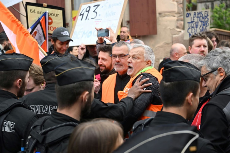 Police pushed back demonstrators in a village in eastern France ahead of the arrival of President Emmanuel Macron
