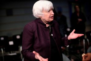 U.S. Treasury Secretary Janet Yellen talks with other attendees at the Annual Meetings of the International Monetary Fund and World Bank in Washington