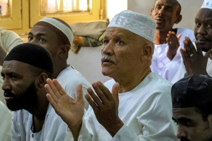 Muslim worshippers pray on the first day of Eid al-Fitr, which marks the end of Ramadan, at a mosque in Khartoum
