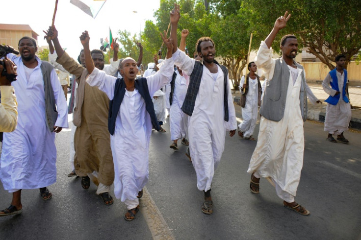 Waving sticks and banners, burhan loyalists demonstrate in the eastern trade hub of Port Sudan