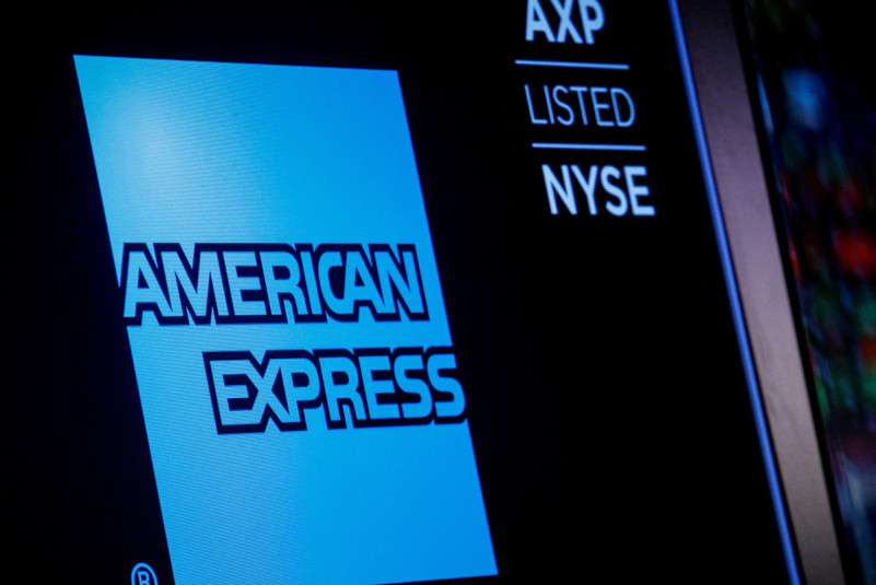 American Express logo and trading symbol are displayed on a screen at the NYSE in New York