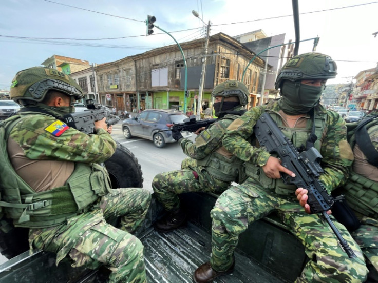 Ecuadoran soldiers patrol the streets of the port city of Esmeraldas, on the border with Colombia, on April 21, 2023