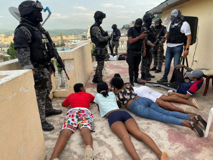 Ecuadoran police and soldiers raid a home in Esmeraldas, a city stricken with high crime