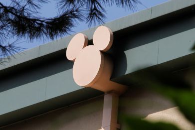A rain spout stylized with the outline of Disney character Mickey Mouse is seen on a building at The Walt Disney Co. studios in Burbank