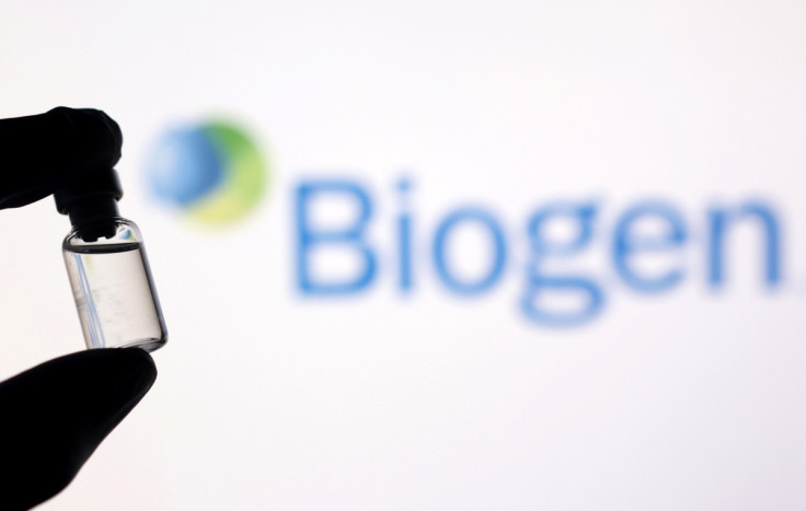 Illustration shows a vial in front of displayed Biogen logo
