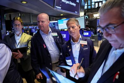 Traders work on the floor of the NYSE in New York