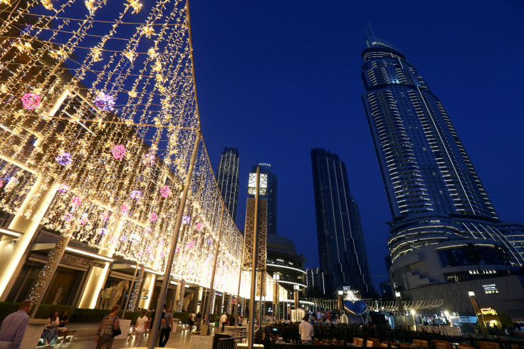 People walk outside The Dubai Mall in Dubai