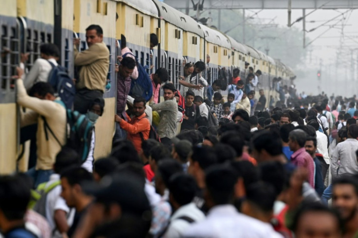 Every day tens of millions of Indians sit idle on gridlocked highways and hang from the sides of packed trains in what is becoming the world's most populous nation