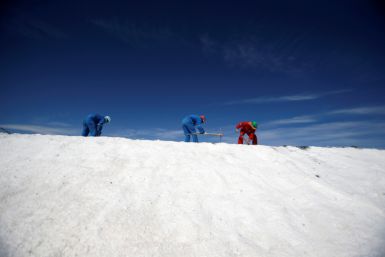 Labourers work at a lithium plant on the Atacama salt flat