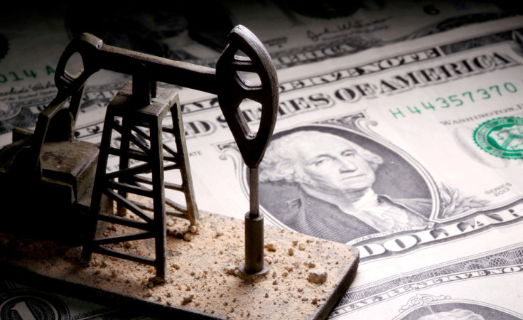 A 3D printed oil pump jack is placed on dollar banknotes in this illustration picture