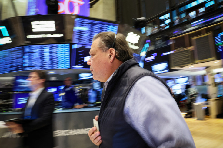 Traders work on the floor of the NYSE in New York