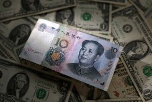 Illustration shows Chinese Yuan and U.S. dollar banknotes