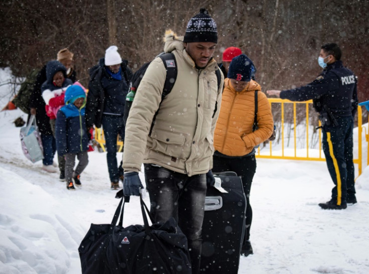 Migrants from Venezuela, Nigeria, Haiti and other countries arrive at the Roxham Road border crossing in Quebec from the United States into Canada on March 2, 2023