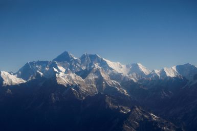 Mount Everest, the world highest peak, and other peaks of the Himalayan range are seen through an aircraft window during a mountain flight from Kathmandu
