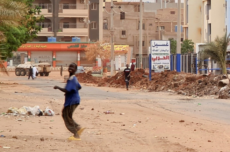 A Sudanese army armoured personnel carrier is parked near a trench in Khartoum as fighting continues between Sudan's army and paramilitary forces