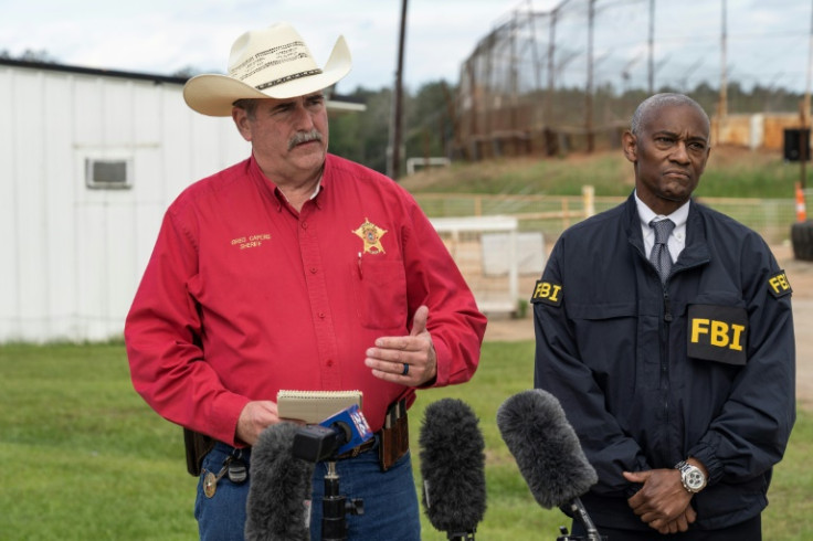 San Jacinto County Sheriff Greg Capers and Special Agent in Charge of the FBI Houston James Smith address the media