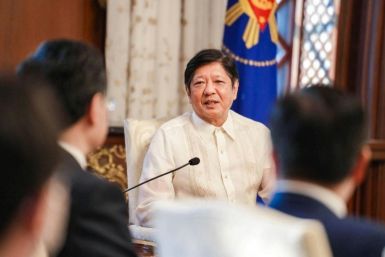 Philippine President Ferdinand Marcos welcomes Chinese Foreign Minister Qin Gang during a courtesy call in Manila on April 22, 2023
