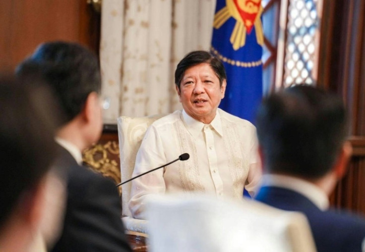 Philippine President Ferdinand Marcos welcomes Chinese Foreign Minister Qin Gang during a courtesy call in Manila on April 22, 2023
