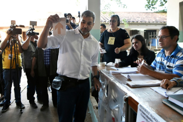 Paraguayan President Mario Abdo Benitez, seen here voting in Asuncion as polls open, is constitutionally limited to one term, but his long-ruling Colorado Party is hoping to retain power despite a center-left coalition leading in polls