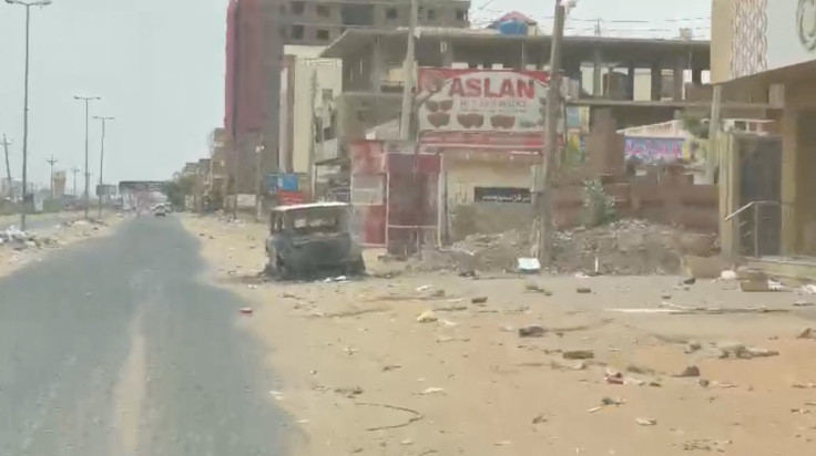 A view shows a damaged car at Martyr Muhammad Hashem Matar Street in Bahri, Khartoum North, Sudan