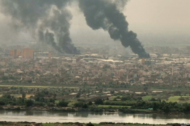 Black smoke rises over Khartoum in this image from AFPTV video on April 28, 2023
