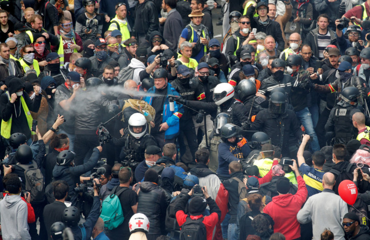 French police apprehend protesters during the traditional May Day labour union march with French unions and yellow vests protesters in Paris