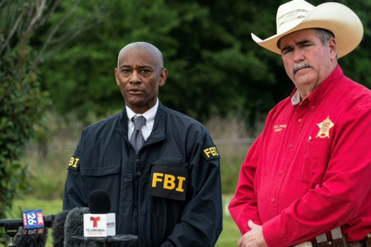 FBI special agent James Smith and San Jacinto County Sheriff Greg Capers speak to the media