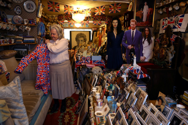 Margaret Tyler a life long royals fan puts on her jacket at her home in Wembley