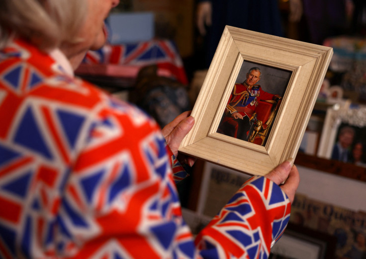 Margaret Tyler a life long royals fan holds a photo of King Charles III at her home in Wembley