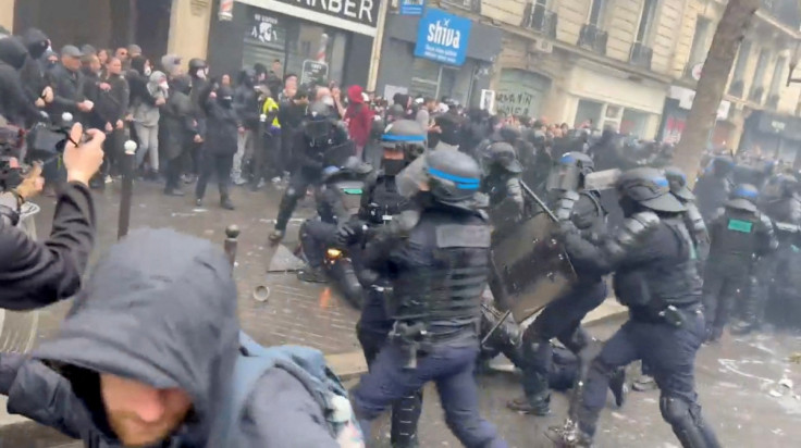 Police officer on fire in Paris protest