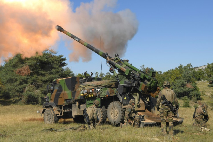 Members of the French army fire a Howitzer artillery system during a high intensity shooting exercice in Canjuers, southeastern France, on October 11, 2021