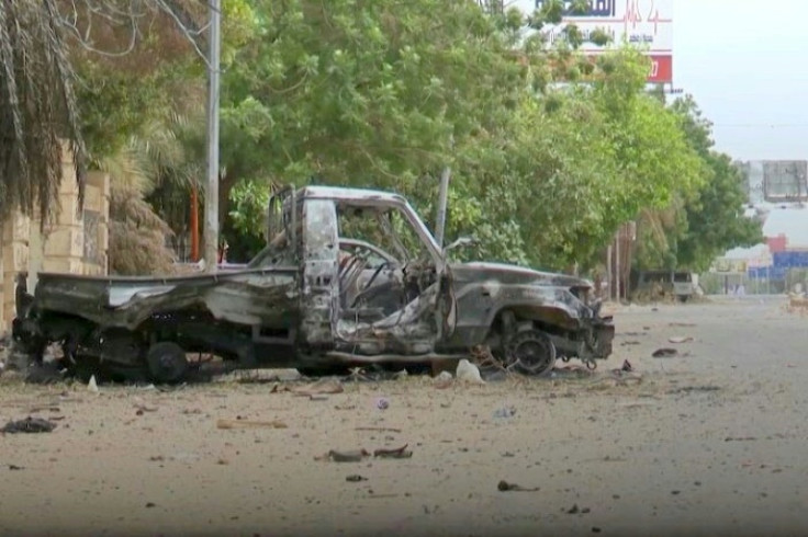 A burnt out military vehicle lies abandoned near the presidential palace, one of the main battlegrounds in nearly three weeks of fighting between Sudan's rival generals