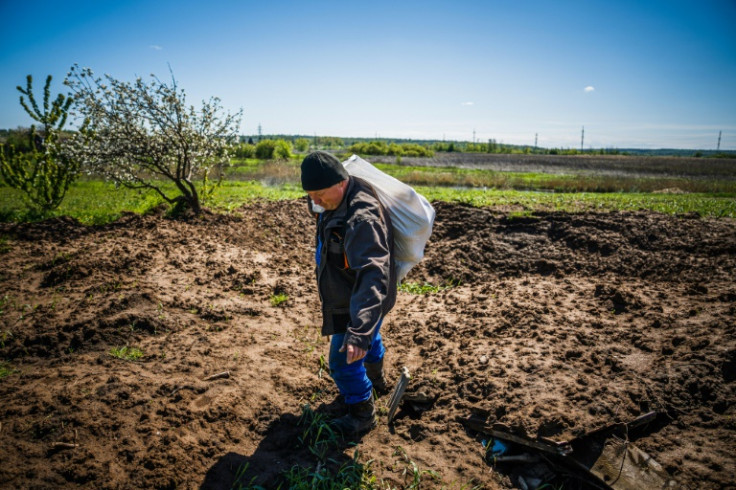 Oleksandr Vashenko carries bread to his neighbours in eastern Ukraine