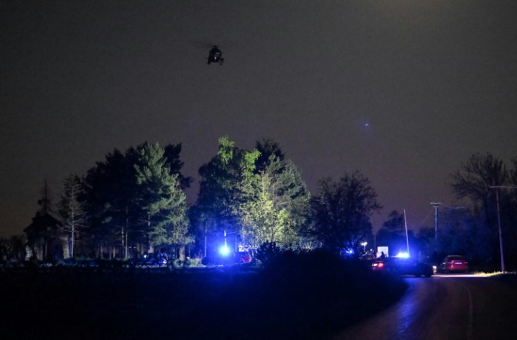 A helicopter hovers as police block the road near the village of Malo Orasje, about 60 kilometres (37 miles) south of Serbia's capital Belgrade