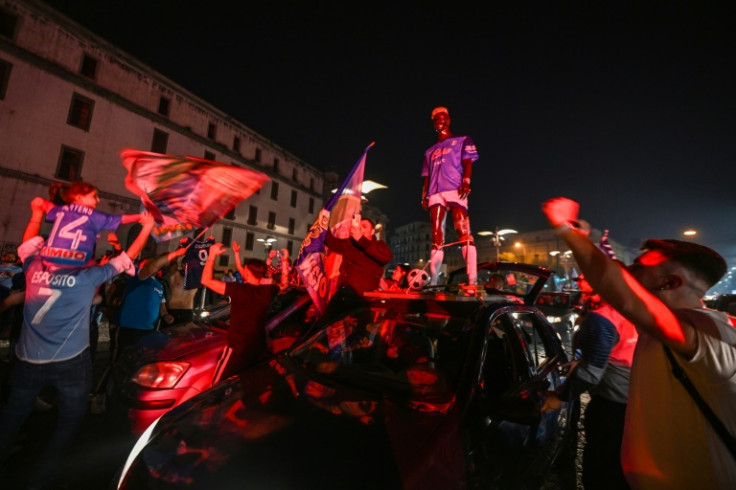 Napoli fans celebrate with , with an effigy of Nigerian Victor Osimhen, scorer of the decisive goal against Udinese