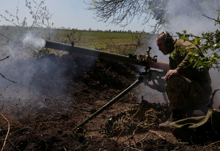 A Ukrainian service member fires an anti-tank grenade launcher at a front line near the city of Bakhmut