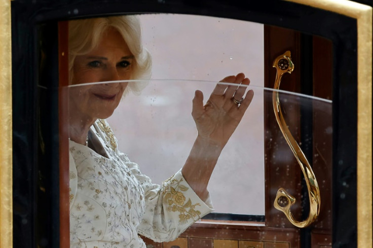 Queen Camilla wore an ivory silk dress by British couturier Bruce Oldfield