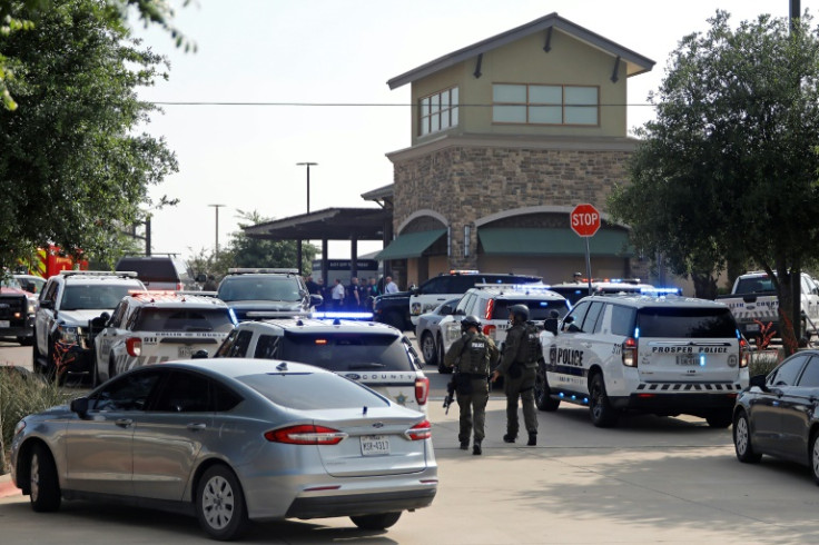 Emergency personnel work the scene of a deadly shooting at a shopping mall in Allen, Texas on May 6, 2023
