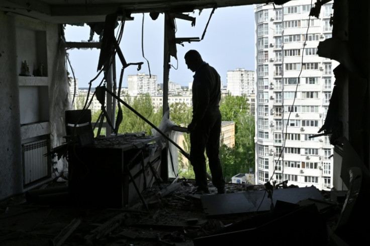 Mayor of the Ukrainian capital Kyiv, Vitali Klitschko, examines a high-rise residential building damaged by remains of a downed Russian drone