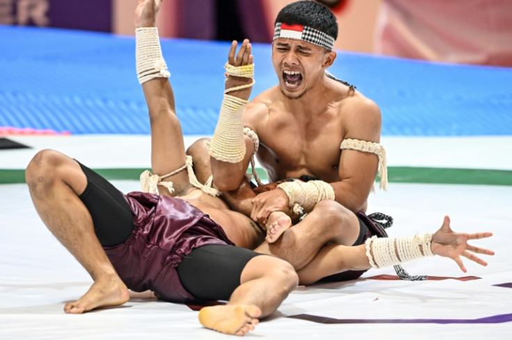 Indonesian competitors in a kun bokator performance event in Phnom Penh