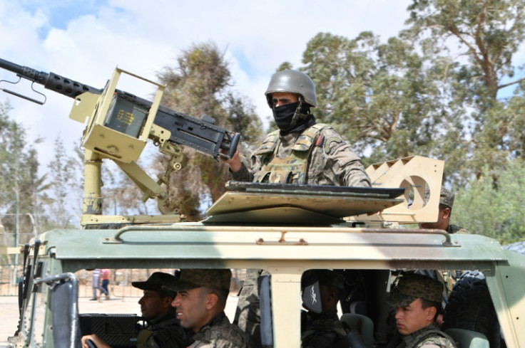 Tunisian soldiers secure the area near the Ghriba synagogue following the shooting rampage