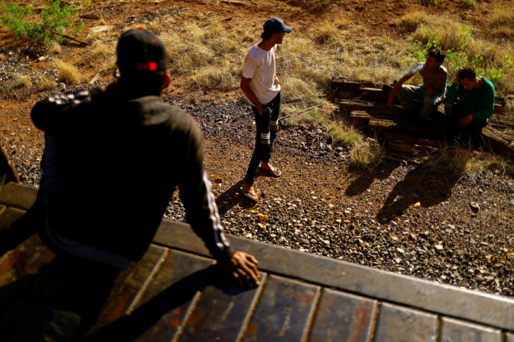The Wider Image: Migrants risk life and limb to jump Mexico trains in rush to border