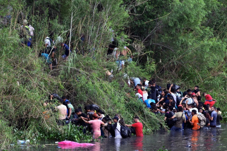 Migrants cross the Rio Grande river to the United States from Matamoros in northeastern Mexico