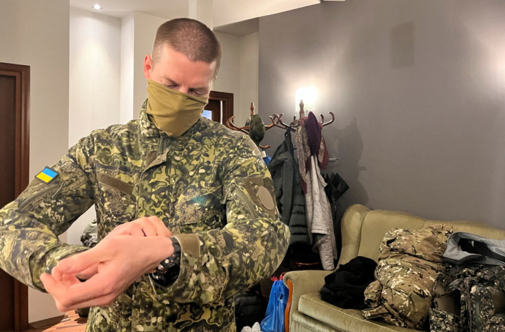 Danil Yugoslavsky gets ready in Civic Council’s Warsaw office, hours before crossing into Ukraine