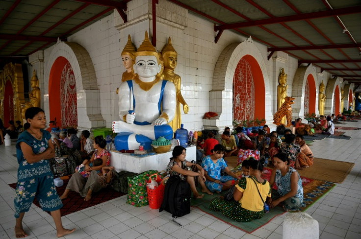 People shelter at a monastery in Sittwe town in Myanmar's Rakhine state on Friday
