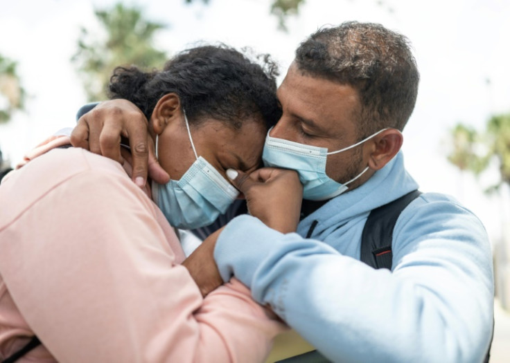 Melina Martinez Zarate from Mexico and Julio Cesar Garcia Lugo from Venezuela celebrate their arrival in the United States after obtaining an appointment to seek asylum