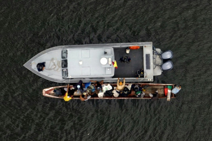 Aerial view of an Ecuadoran navy launch checking a small boat in an area near Guayaquil used by drug traffickers